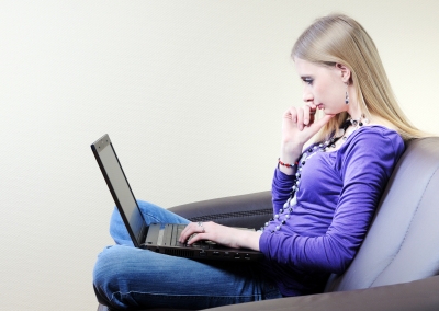 girl using laptop computer